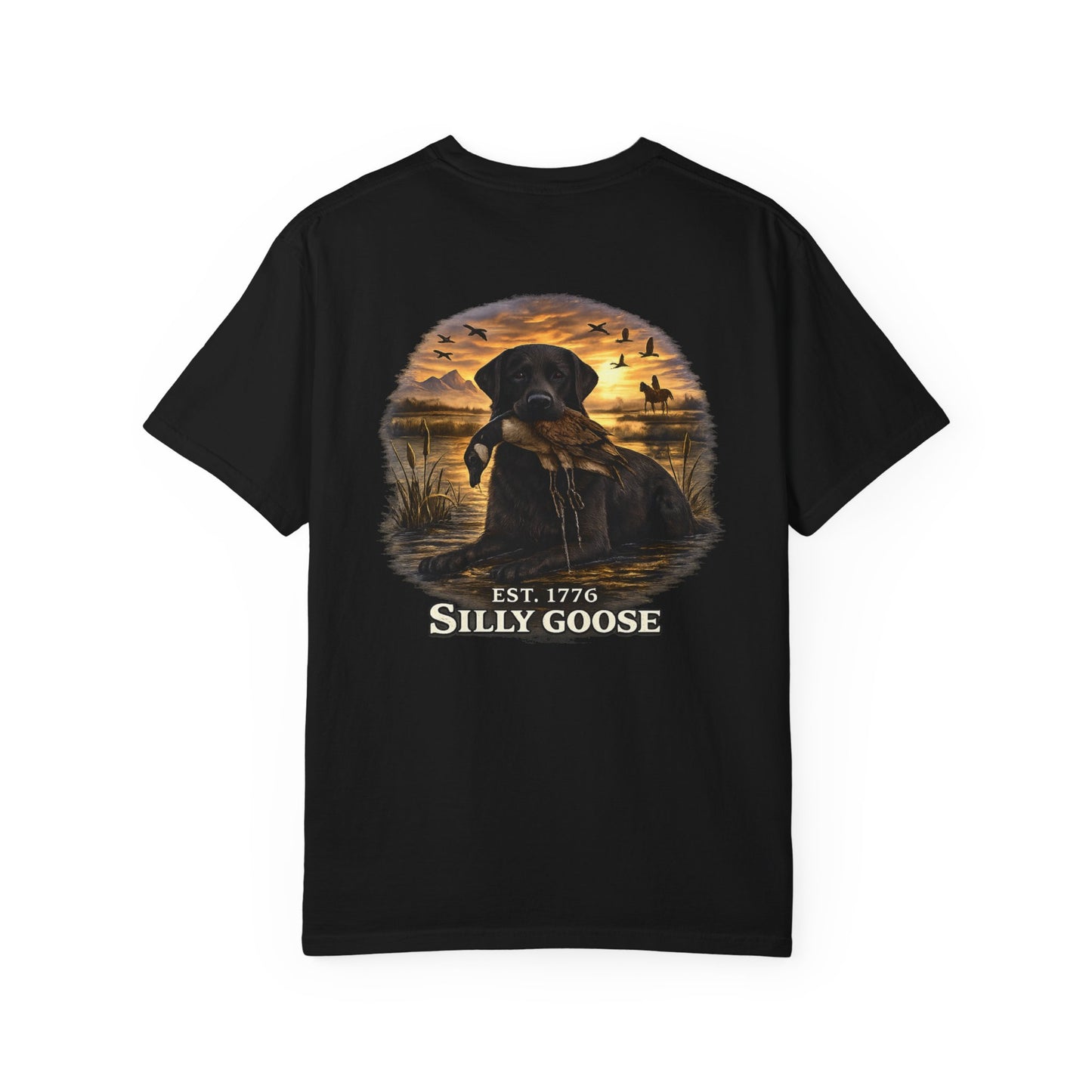 Black t-shirt with a graphic of a dog and sunset scene on the back, featuring the text 'Est. 1776 Silly Goose'.