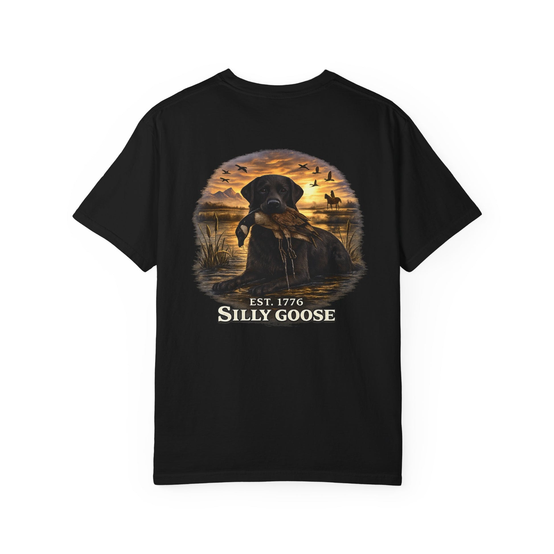 Black t-shirt with a graphic of a dog and sunset scene on the back, featuring the text 'Est. 1776 Silly Goose'.
