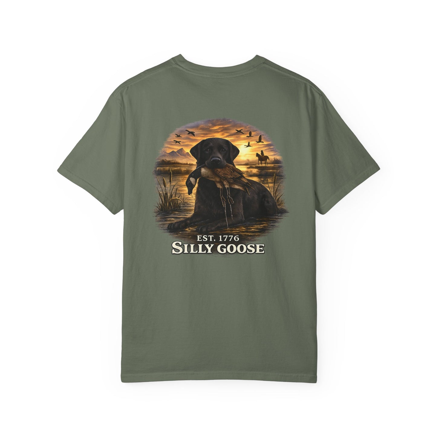 Green t-shirt with a graphic of a dog and sunset scene on the back, featuring the text 'Silly Goose'.