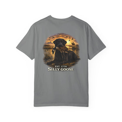 Gray t-shirt with a graphic of a dog and sunset scene on a white background