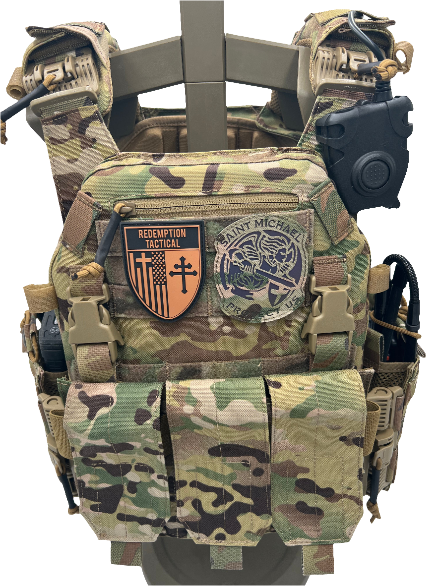Camouflage tactical vest with various patches on a white background