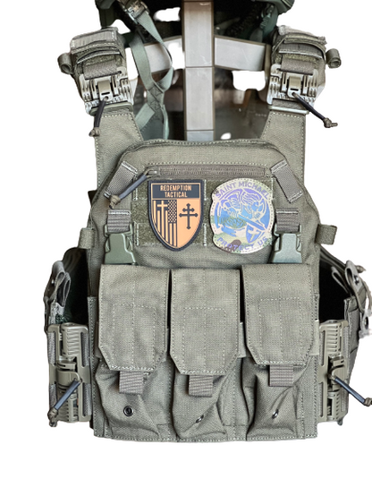 Tactical vest with multiple pockets and patches on a white background