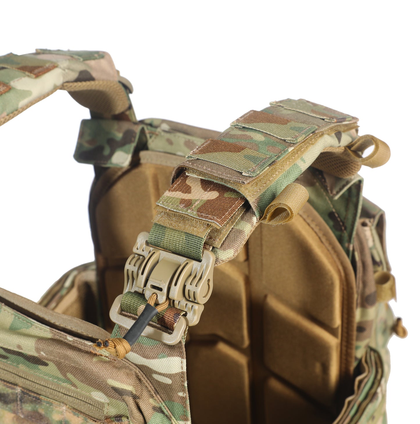 Camouflage tactical vest with multiple straps and buckles on a white background