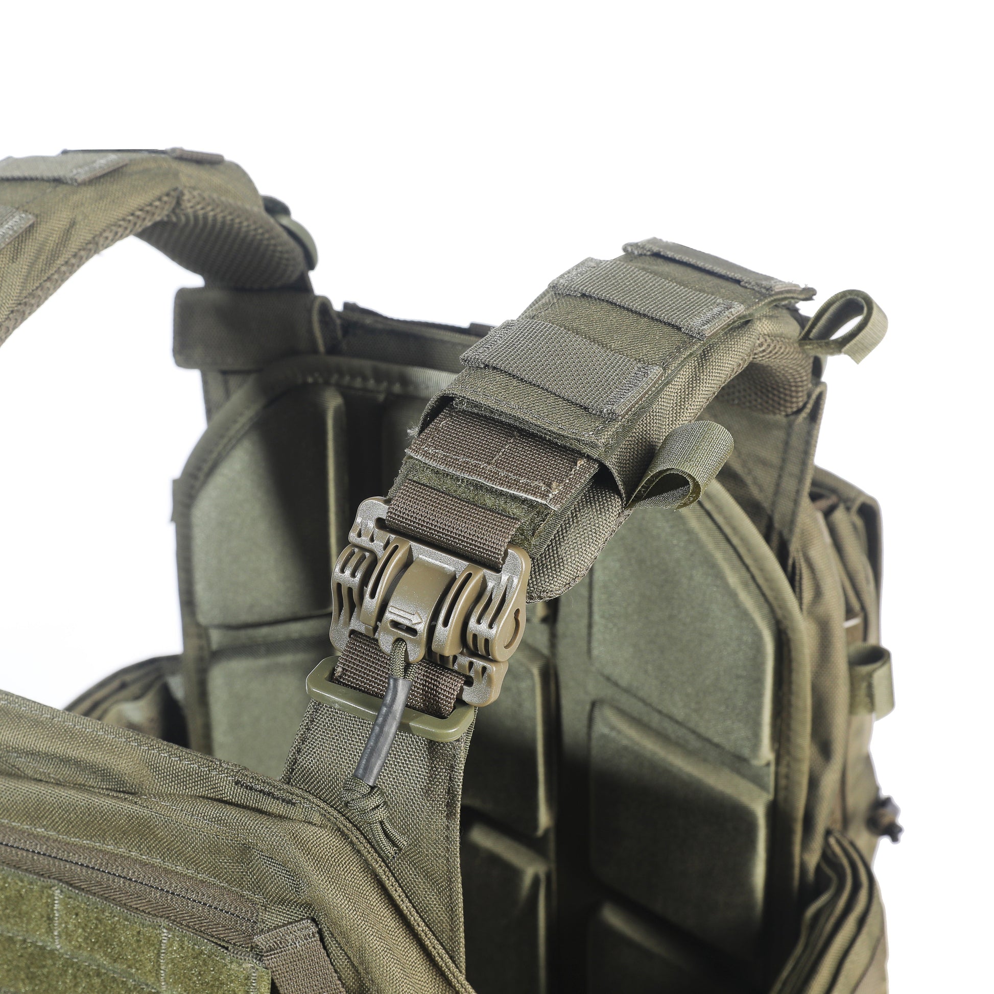 Close-up of a tactical vest with multiple straps and buckles on a white background